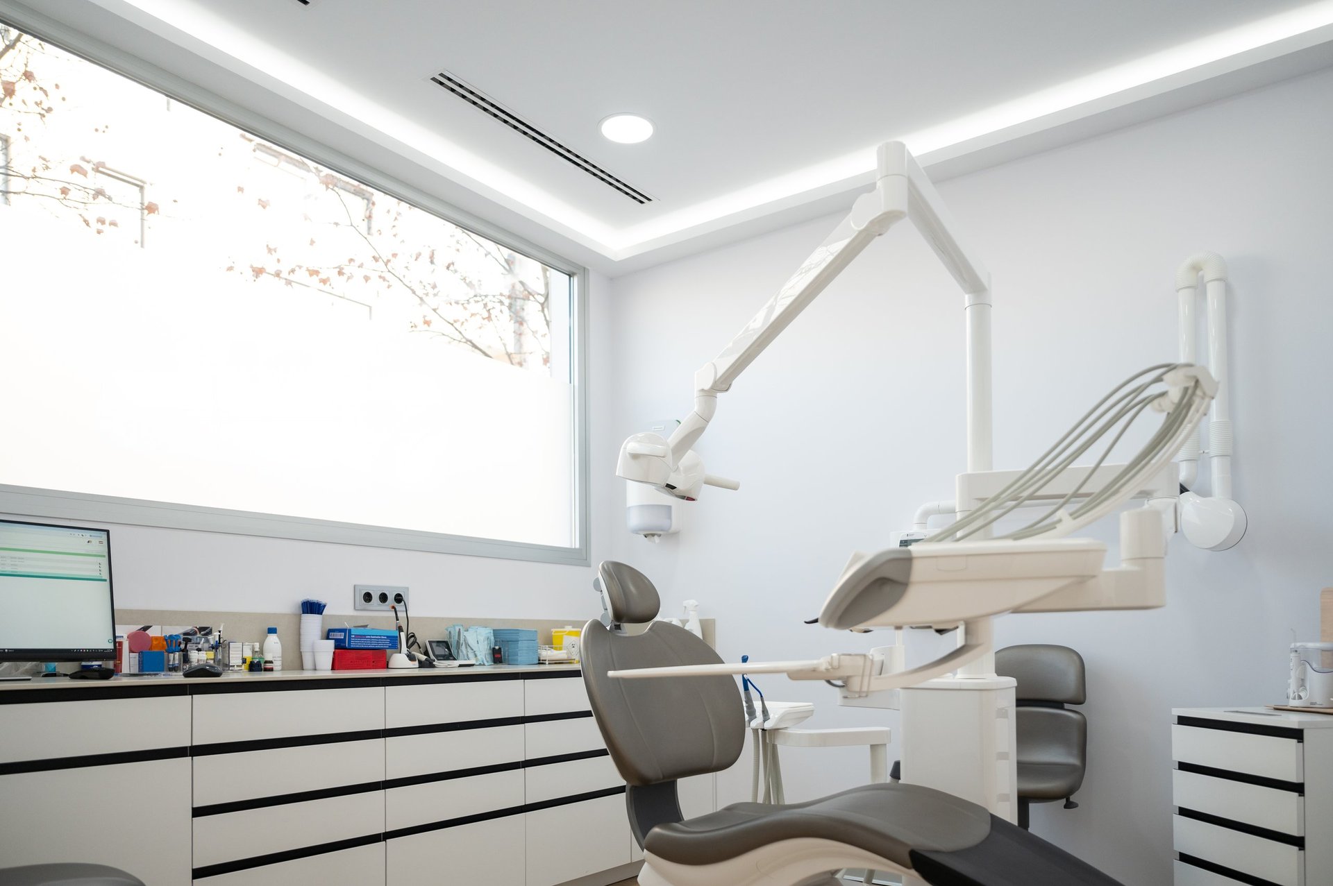 Modern dental clinic interior with professional equipment and comfortable dental chair